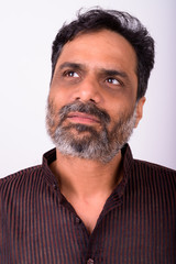 Fototapeta premium Portrait of mature handsome bearded Indian businessman