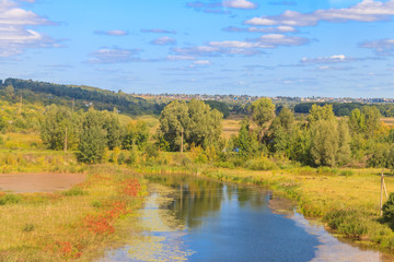 Summer landscape with beautiful river, green trees and blue sky