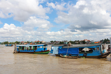 Fototapeta na wymiar View of Mekong River with the dramatic cloudscape and boats in Ho Chi Minh, Vietnam