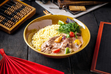 Gourmet dish rice with stewed beef and vegetables