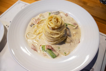 Carbonara pasta. Spaghetti with pancetta, egg, parmesan cheese and cream sauce. Traditional italian cuisine. Top view.