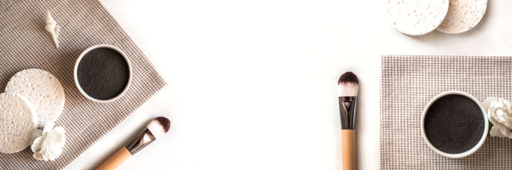 Banner made from cosmetic facial clay masks.