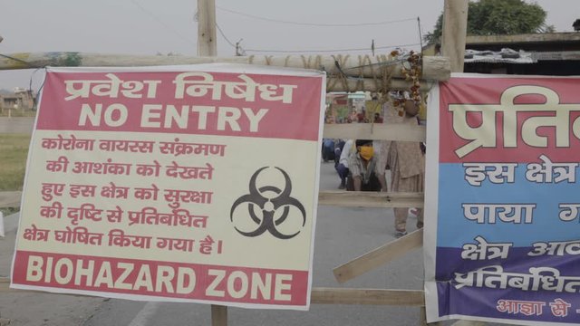 Disaster Pandemic Covid - 19 Corona Virus In India . Lock Down Red Zone Bio Hazard Areas. Police And Local Administration Helping People In Red Zone . 