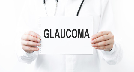 Doctor holding a card with text Glaucoma medical concept