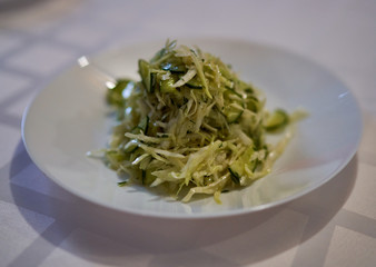 fresh vegetable salad is in a plate