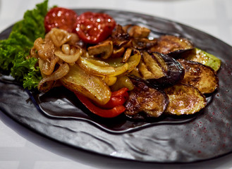 baked vegetables are on a tray in a cafe