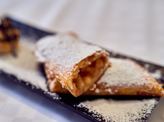 strudel lies on a plate on the table