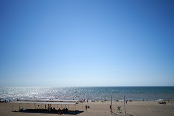 Fototapeta premium people sunbathe by the sea