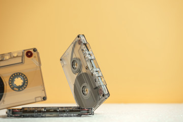 Beautiful Audio cassette tape on a white table and yellow space.Minimalism retro style concept....