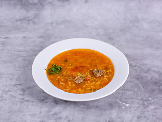 Soup kharcho on the table in a white plate