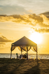 Dinner table set at the beach in Bali