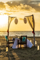 Dinner table set at the beach in Bali
