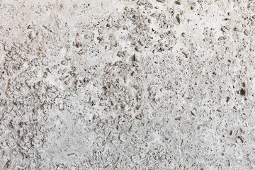Background concrete wall, traces of weathering, worn wall damaged paint old paint. Remains of old paint on the painted concrete surface. Grungy destruction surface.