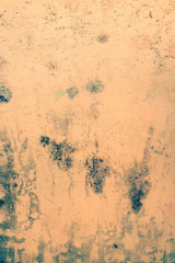 Background concrete wall, traces of weathering, worn wall damaged paint old paint. Remains of old paint on the painted concrete surface. Grungy destruction surface.