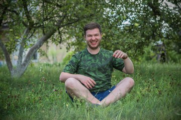 Naklejka na ściany i meble Positive emotions and smiling, young man with good mood, psychology portrait