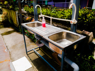 A Public hand wash facility made outside textile showrooms to break the chain of corona virus.