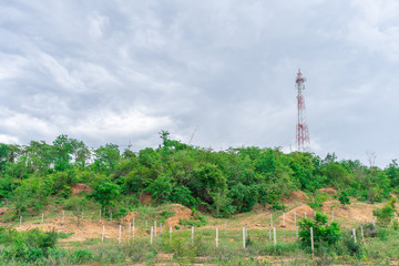 Telephone tower Internet signal The red color on the mountain top With a blue sky background With...