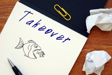 Business concept about Takeover with sign on the sheet.