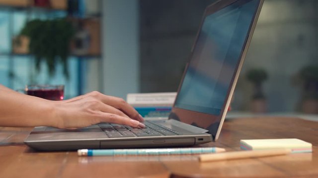 Businesswoman college university student using laptop computer at desk, female hands typing on notebook keyboard studying working with pc technology online education concept on table, close up view