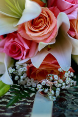 wedding rings in a bouquet of flowers