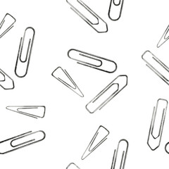Seamless pattern of hand drawn gem paperclips isolated on white. Metal device to hold and fasten  sheets of paper. Backdrop with bended steel wire for school, office and hobby. Elements of stationery.