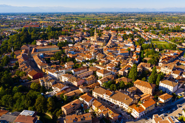 Scenic cityscape from drone of Italian town of Portogruaro in sunny day, Veneto, Italy
