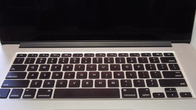 4340 - Man Typing the Letter R Key on Laptop Computer