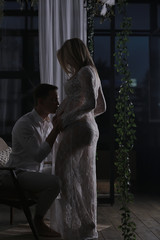 big belly pregnancy man kisses / family and childbirth, concept of family happiness and love, man and woman