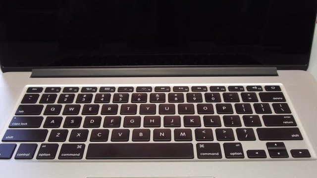 4341 - Man Typing the Letter S Key on Laptop Computer