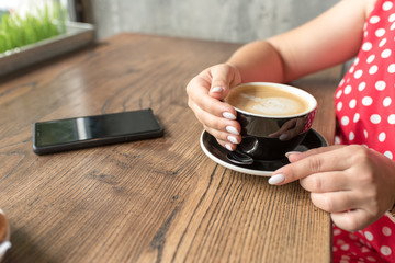 woman holding a cup of coffee. cup of coffee