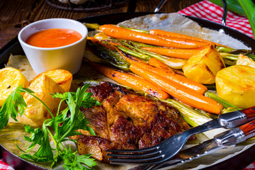 grilled neck chops with caramelized vegetables.