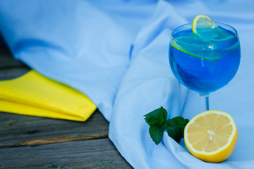 Cooling blue summer cocktail. Ice, mint, lemon.