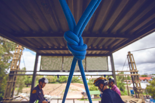 Rescue team in action practicing training for the use of ropes for rescue of high buildings, Focus safety rope. - Powered by Adobe