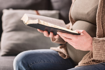 Pregnant Woman Studying the Bible at Home