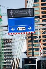 COVID-19 Social Distancing Street Sign in a City Center