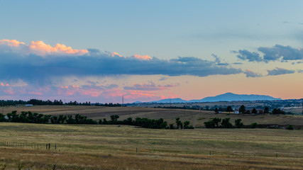Fototapeta na wymiar Sunset on the Colorado Eastern Plains near Denver includes this magestic view of Pikes Peak