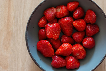 A bowl of fresh red strawberries