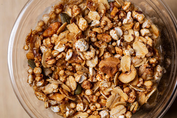 Many different raw seeds nuts on a glass pot
