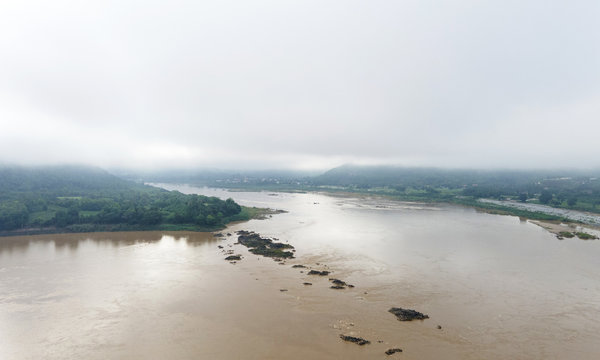 Aerial panoramic view fog covered River in mountain, sky cloud background, Blank for design, in the morning time..