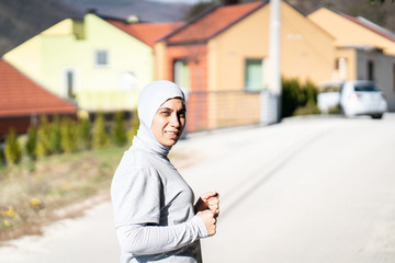 Adult Muslim Woman running in Nature