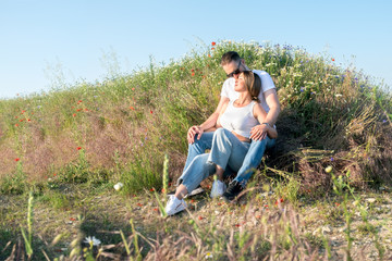 Mom, dad and little daughter. Happy family on the walk.