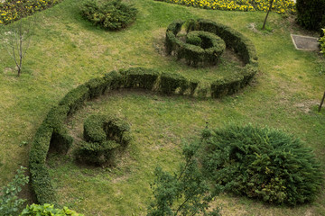 An arrangement with a special grass design in a Romanian city photographed from above. Selective focus