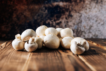 Mushrooms on a wooden background close up