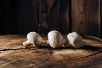 Mushrooms on a wooden background close up