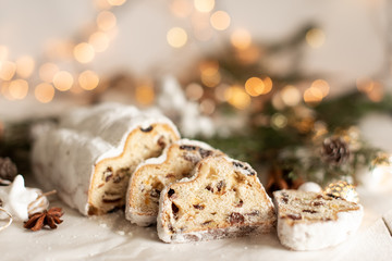 Christmas stollen on wooden background. Traditional Christmas festive pastry dessert. Stollen for Christmas.