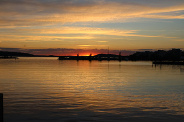 Fototapeta na wymiar The sun sank below the horizon. A walk along the shore of lake Vesijärvi. Lahti. Finland.