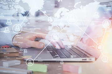 Social network theme hologram with businessman working on computer on background. Concept of world wide web. Multi exposure.