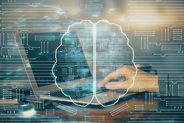 Man typing on keyboard background with brain hologram. Concept of big Data. Double exposure.