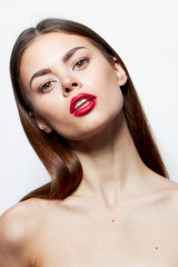 Brunette Bare shoulders red lips head tilted to one side natural look light 