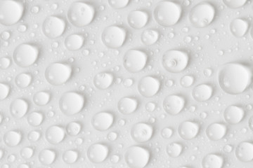 Water drops on gray background. Top view. Closeup.